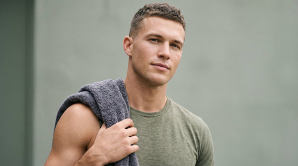 Young man with healthy clear skin after shower