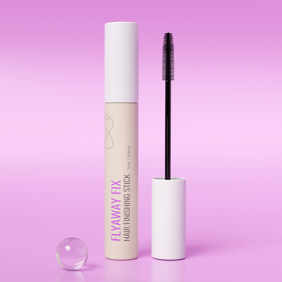 Hair finishing stick with applicator on a pink background